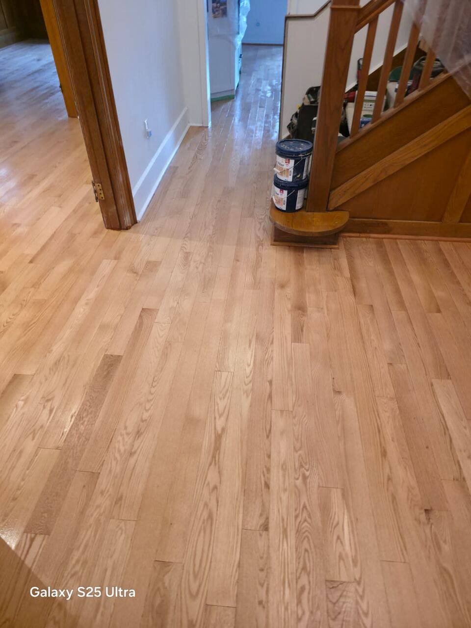 New sanded hardwood floor with a clean, raw wood look before stain and finish are applied