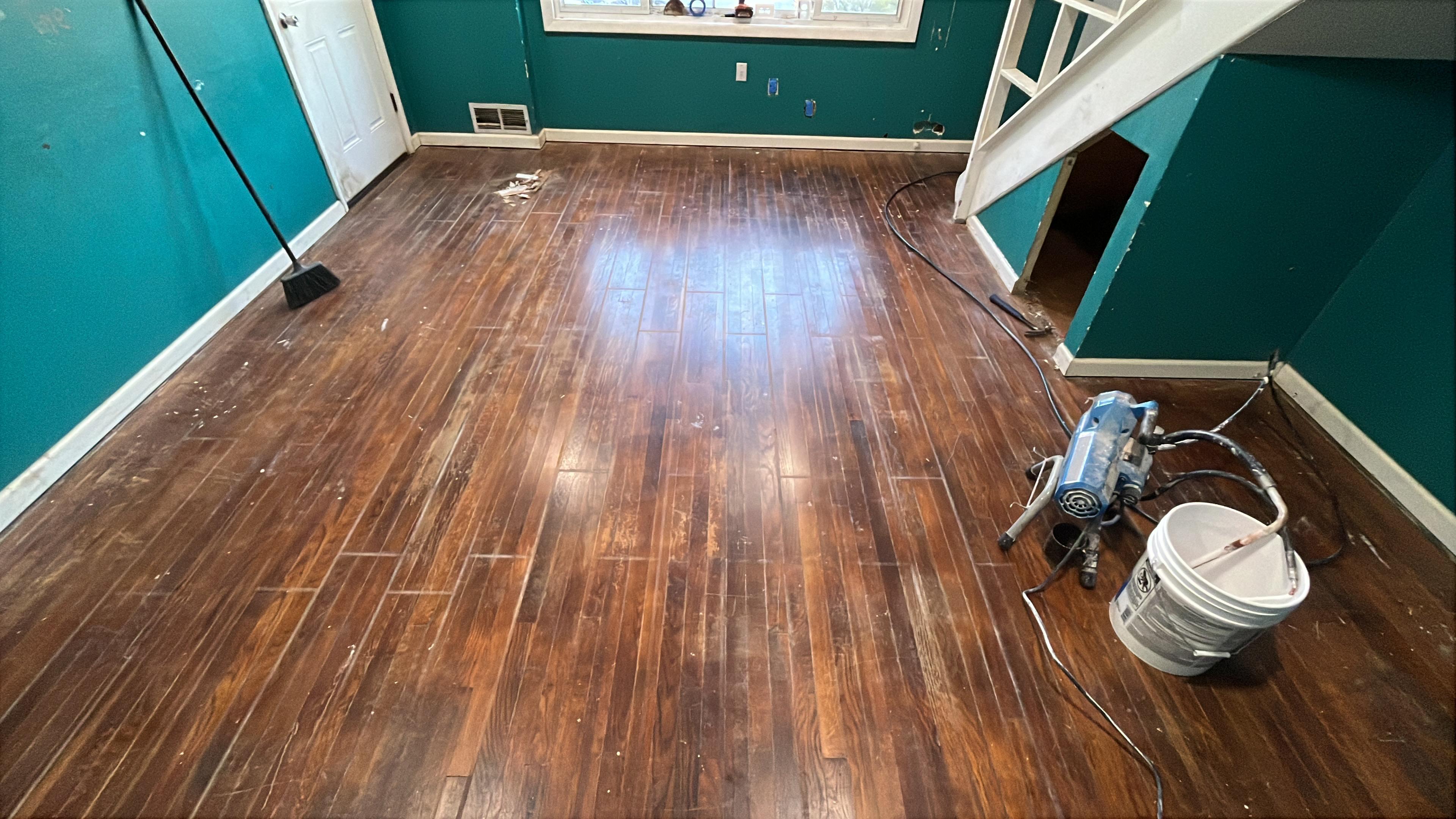 Before refinishing — scratched, dull floor in FairFax, Virigina home