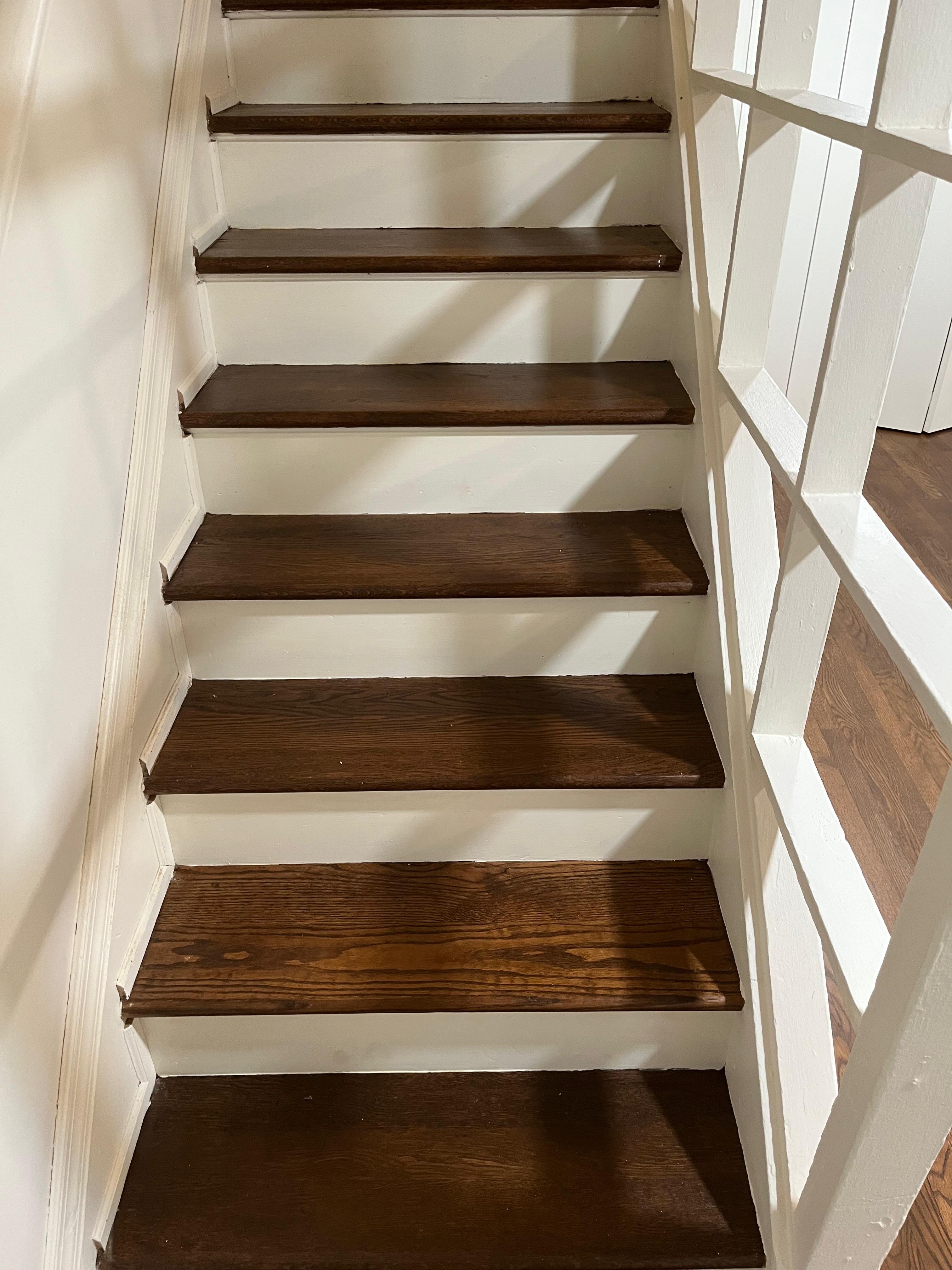 Chevron-patterned hardwood floor refinished with a natural sealer in Alexandria, Virginia home