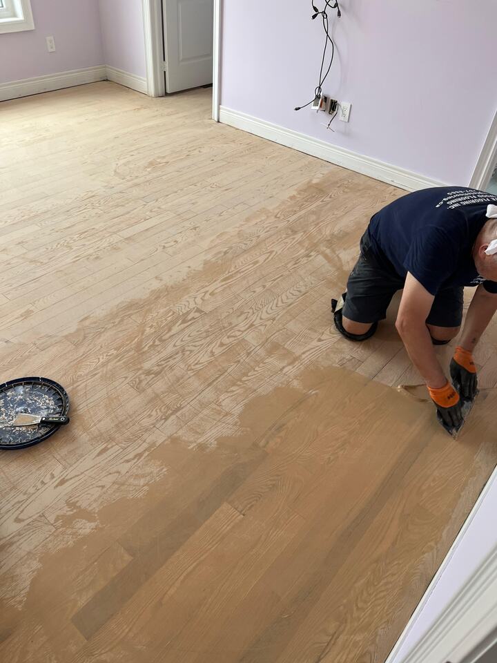Hardwood floor repair with board replacement and stain blending in Washington, DC home
