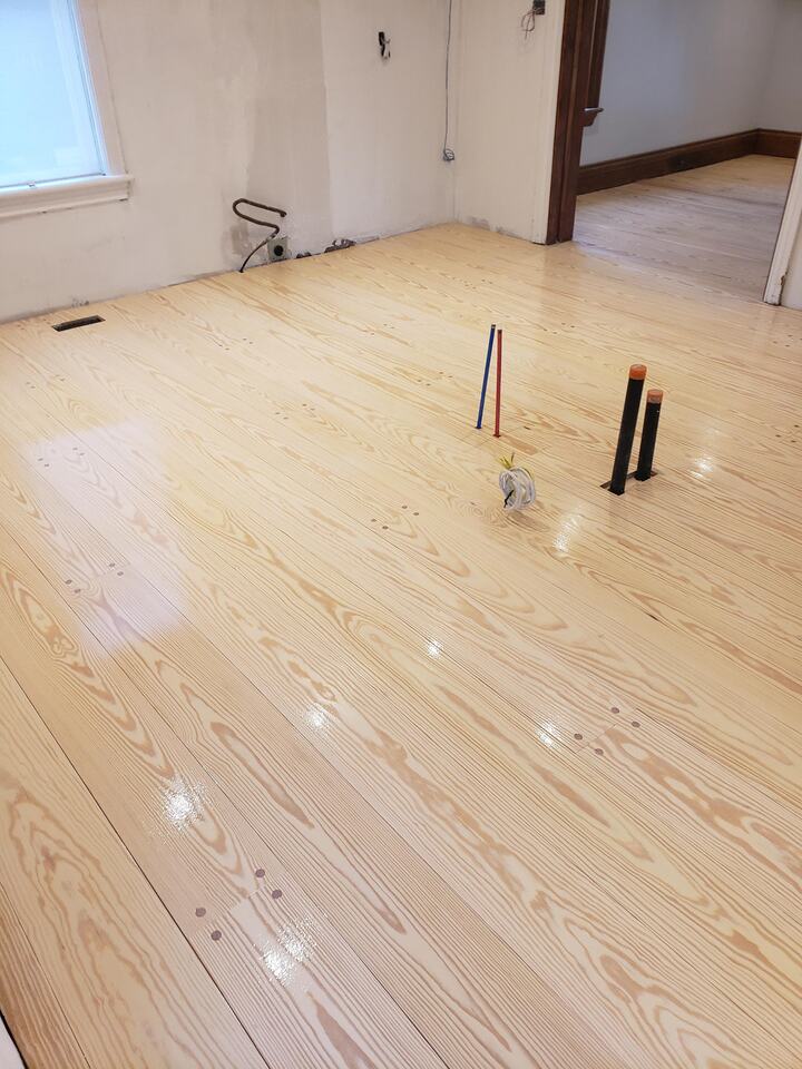 Expert installed hardwood chevron pattern with a natural bona finish in Pentagon City, Virginia home