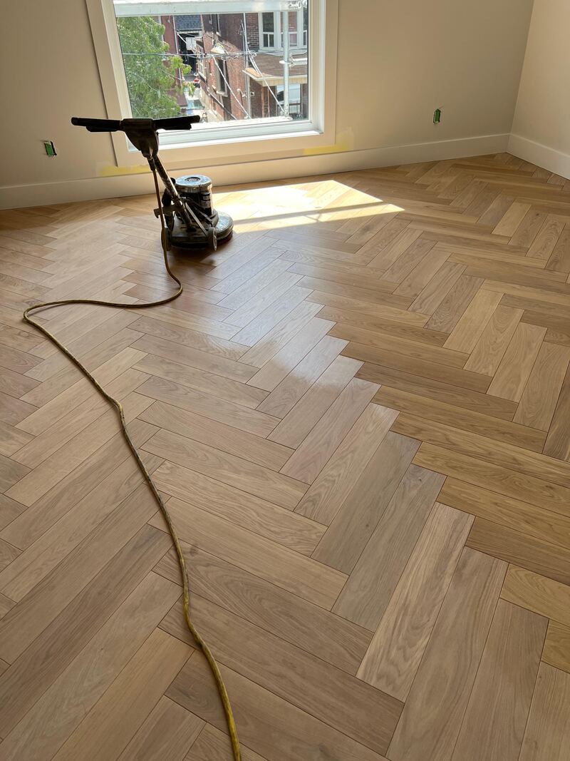 Dust-controlled hardwood sanding setup in Fairfax, Virginia